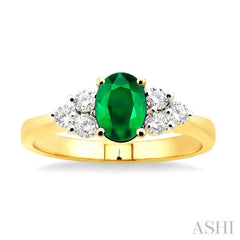 7x5mm Oval Cut Emerald and 1/3 Ctw Round Cut Diamond Ring in 14K Yellow Gold