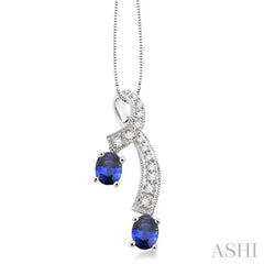 5x4 MM Oval Cut Sapphire and 1/6 Ctw Round Cut Diamond Precious Pendant in 14K White Gold with Chain