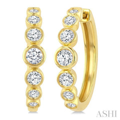 1 1/10 Ctw Graduated Bezel Set Round Cut Diamond Fashion Hoop Earrings in 14K Yellow Gold